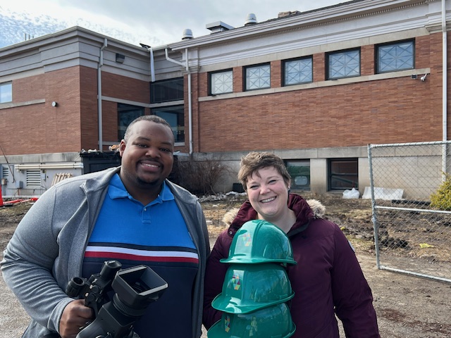 exterior library with TMJ4 news person